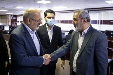 عبدالرسول پورعباس رئیس سازمان سنجش آموزش کشور و محمد کریمی سردبیر خبرگزاری فارس 