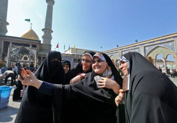 Women posed for a picture before casting their votes